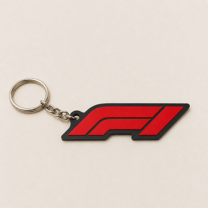 Red and black layered motorsport emblem keychain with silver ring