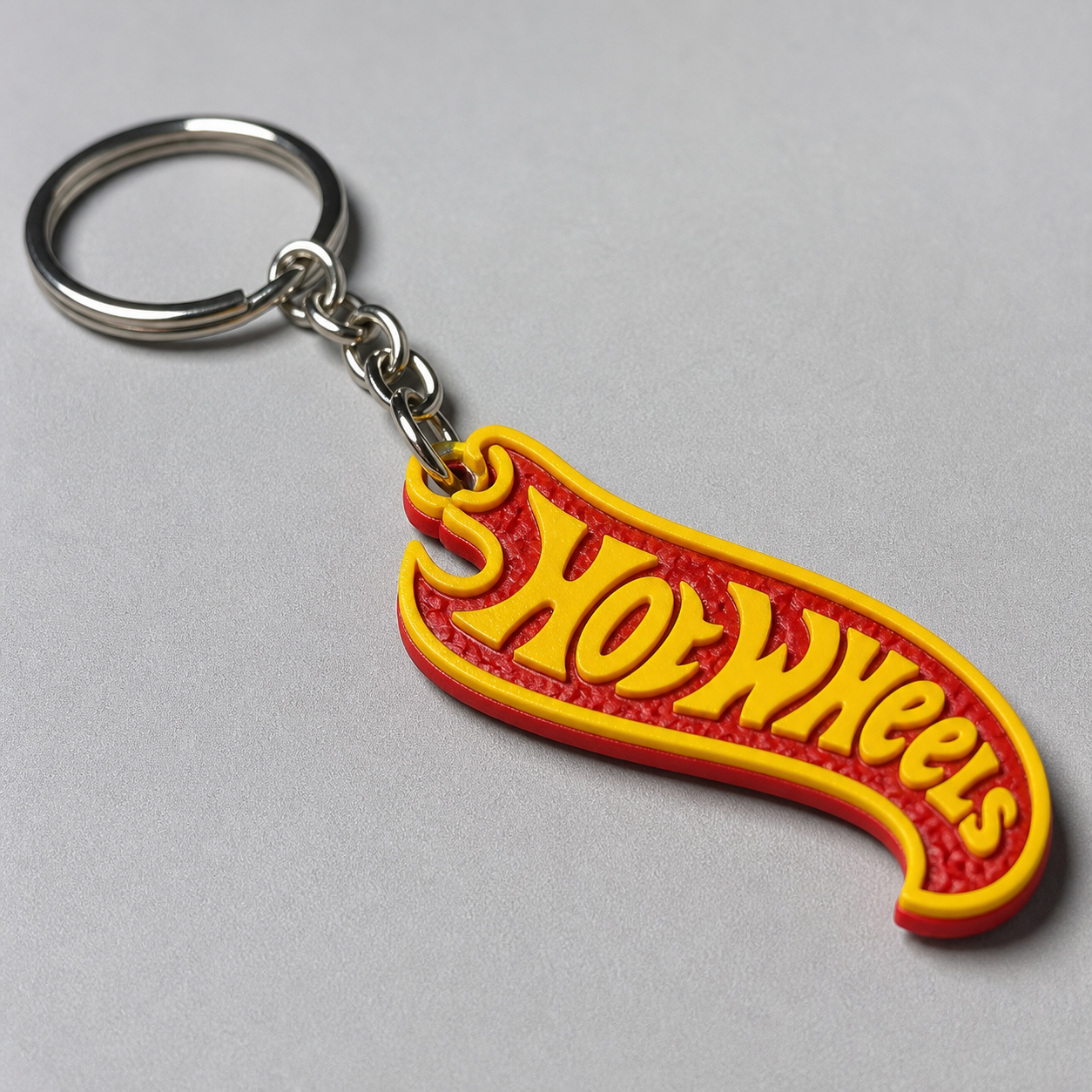 Close-up of red and yellow racing flame keychain texture