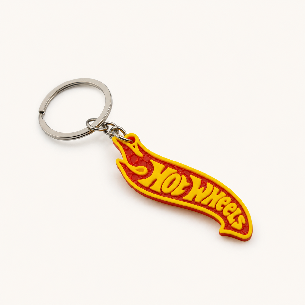 Red and yellow racing flame keychain on a white studio background