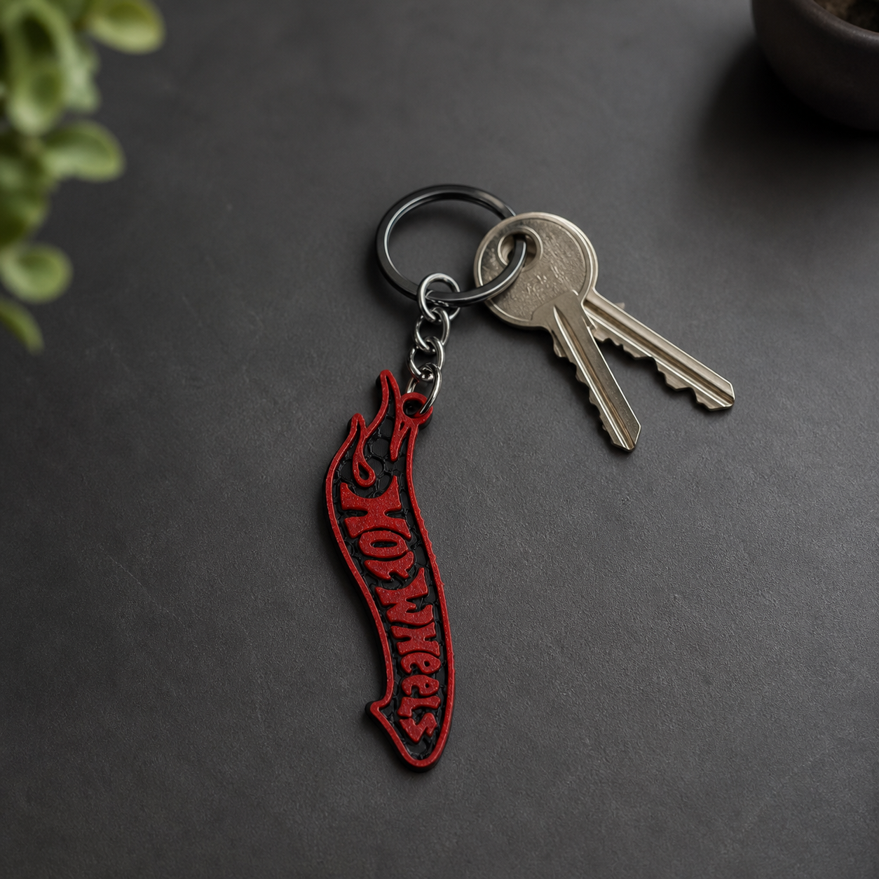 Red and black racing flame keychain attached to house keys