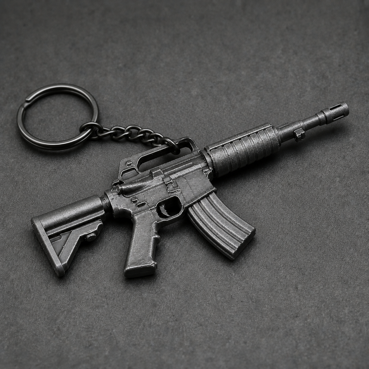 Close-up view of black tactical rifle miniature keychain details